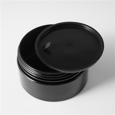 Schwarze kosmetische Behälter